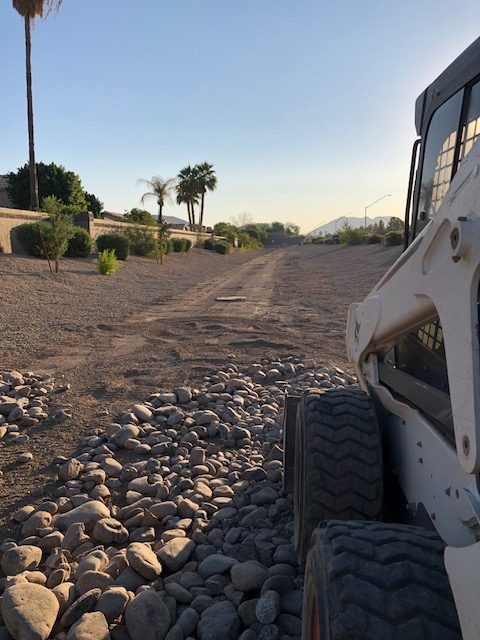 River rock in HOA drainage area